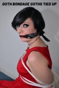 trussedup.com - Foxy Roxy soft core glam goth tattooed rope bondage model tied up in boots thumbnail